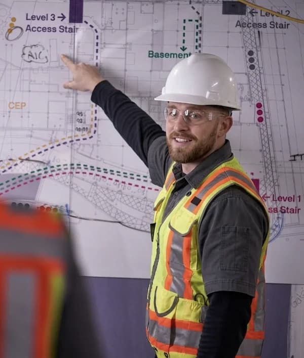 Benjamin Lee Stotts reviewing blueprints on site